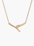 A high-resolution studio shot of an 18K gold-plated snake necklace featuring a sleek, segmented textured design and sparkling cubic zirconia stones on a clean white background