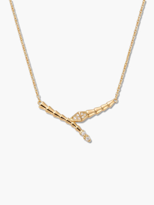 A high-resolution studio shot of an 18K gold-plated snake necklace featuring a sleek, segmented textured design and sparkling cubic zirconia stones on a clean white background