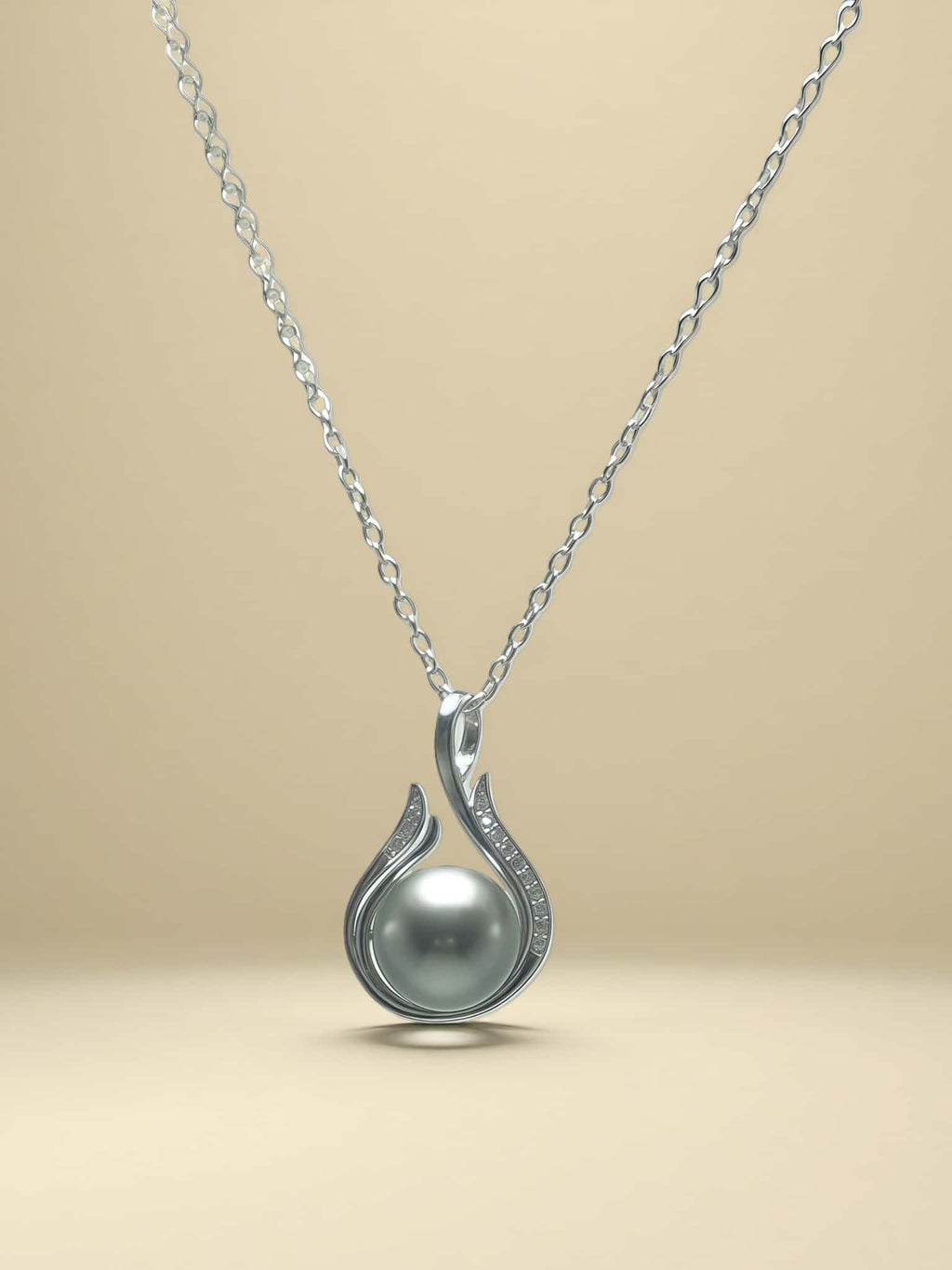 Pearl necklace with silver chain on a beige background