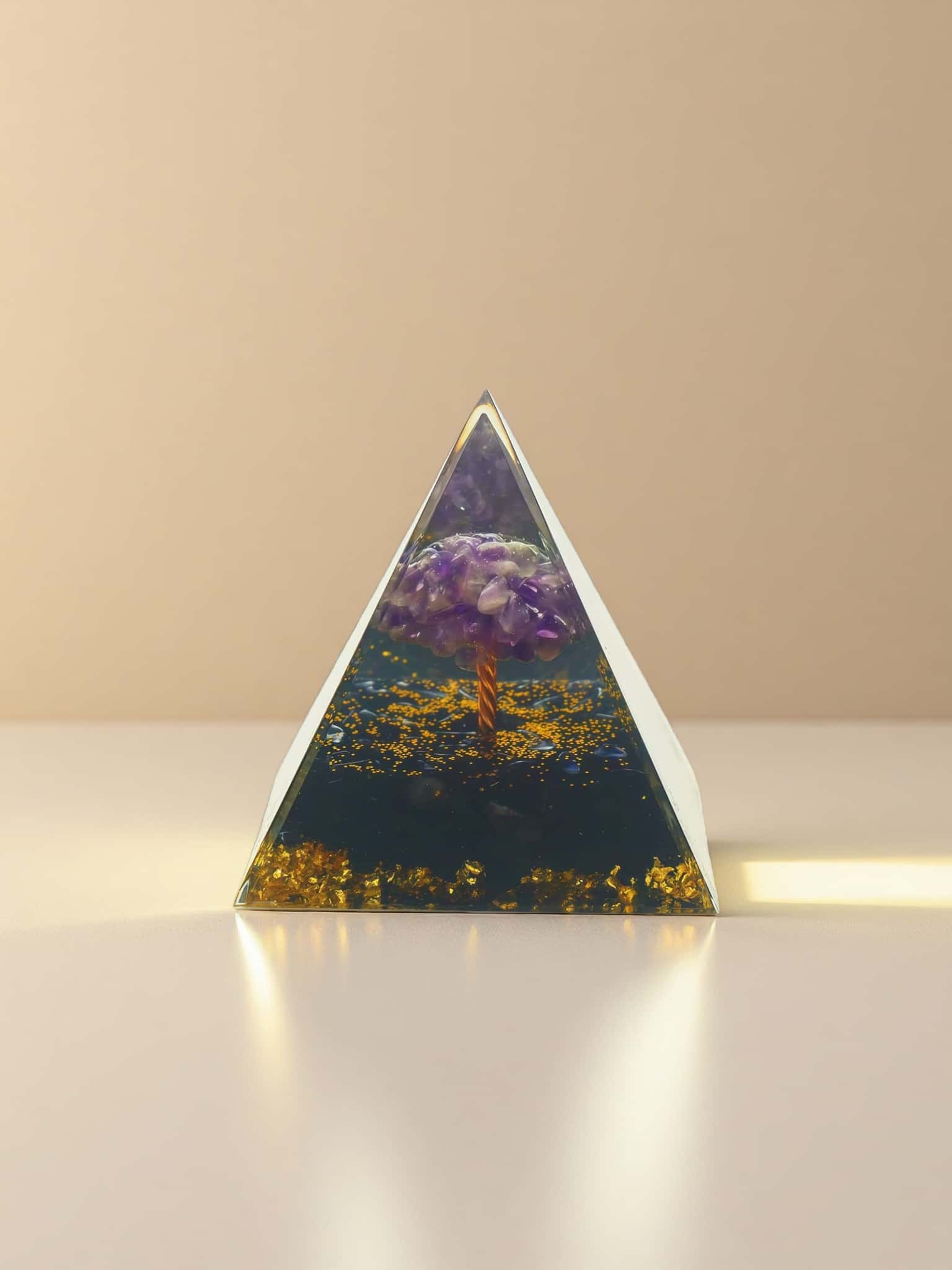 Triangular crystal with a purple crystal and fiery design on a beige background