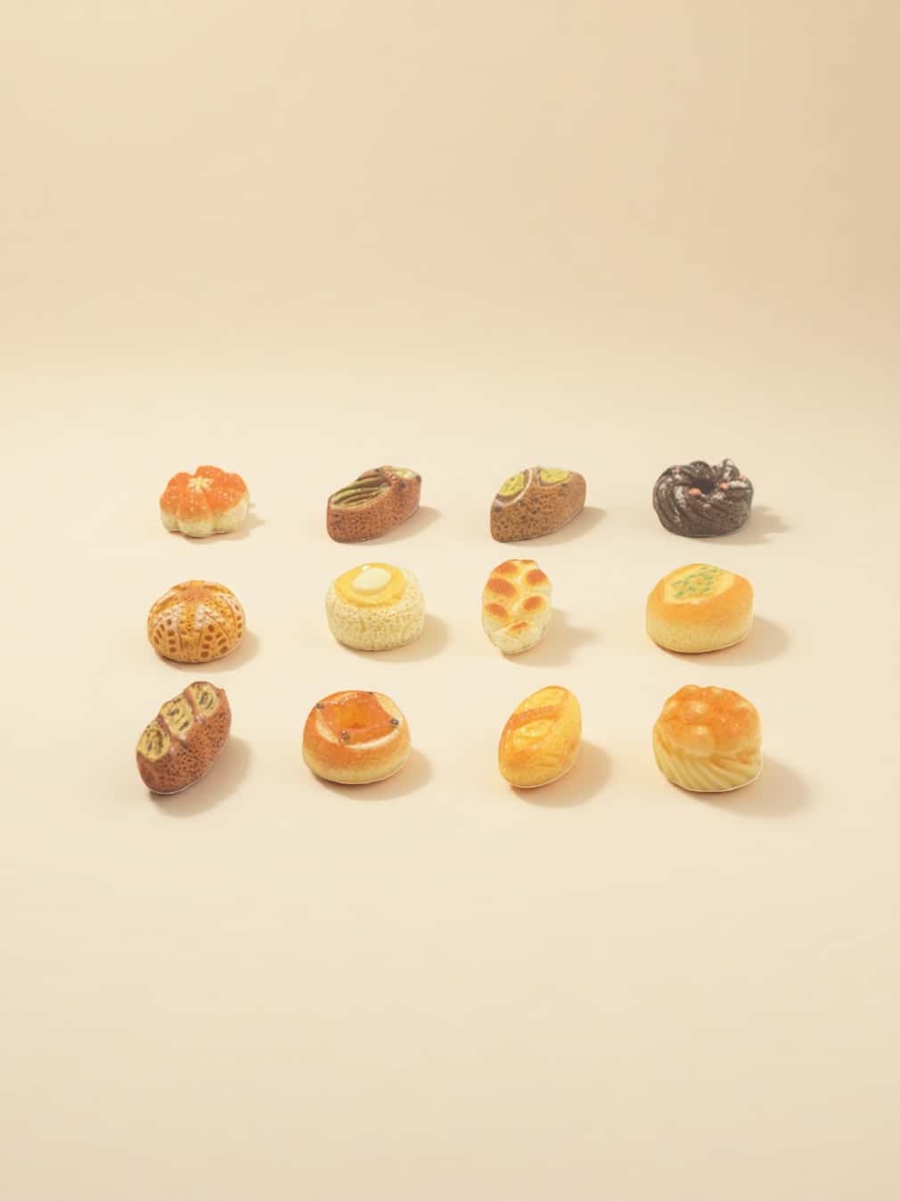 Assorted small baked goods on a beige background