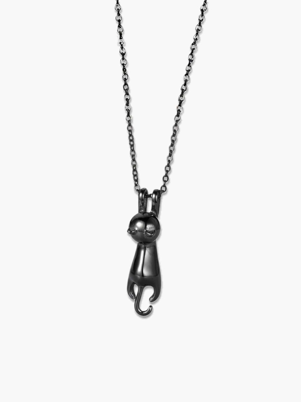 Detailed front view of the glossy black cat pendant showing its modern, fluid silhouette and metallic shine