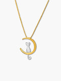 Gold and silver cat moon necklace with crescent design on a white background