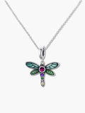 A high-quality studio shot of a dragonfly pendant necklace with vibrant green enamel wings and multi-colored cubic zirconia gemstones on a silver chain