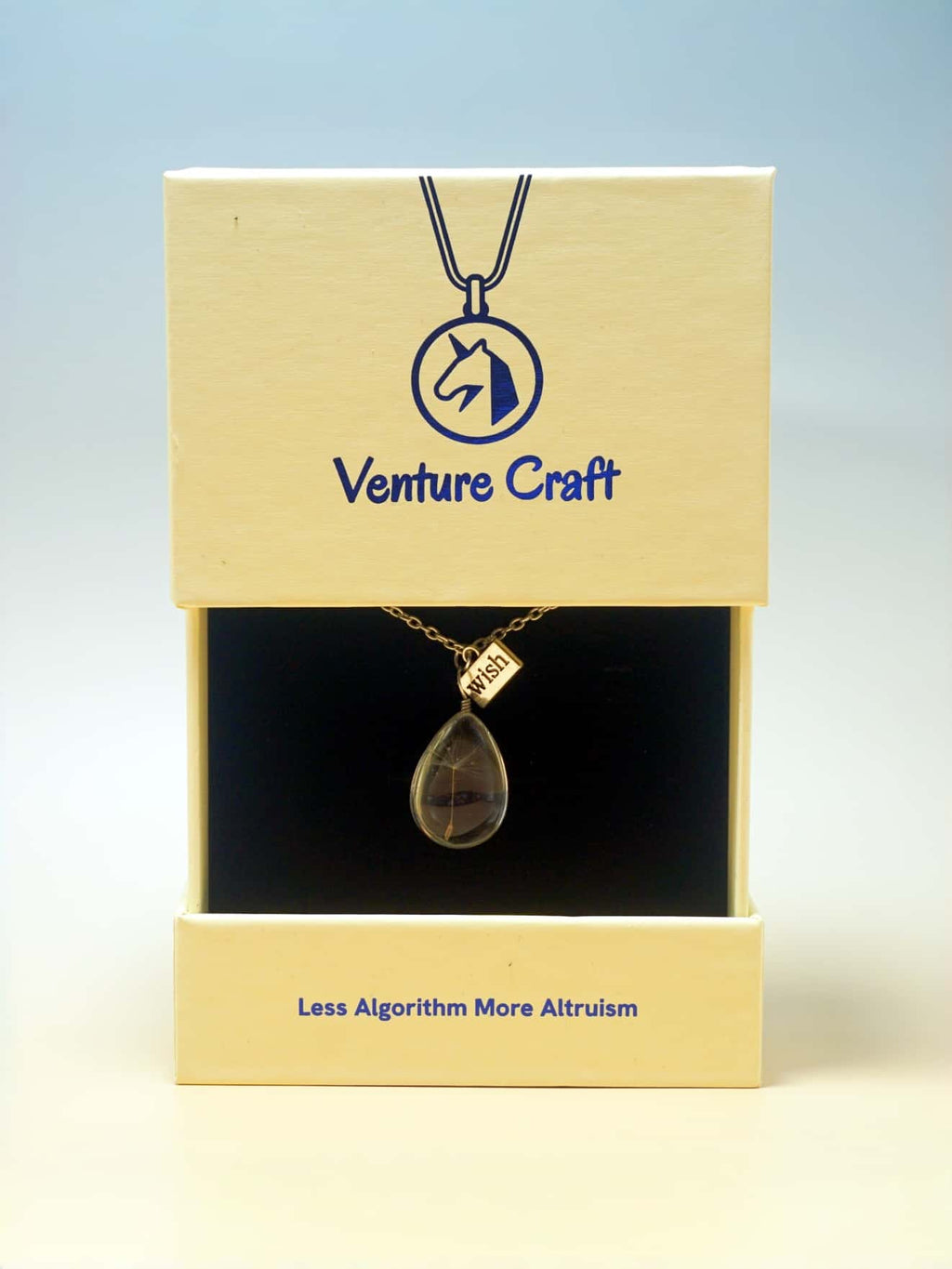 Necklace with pendant in a 'Venture Craft' box on a light blue background
