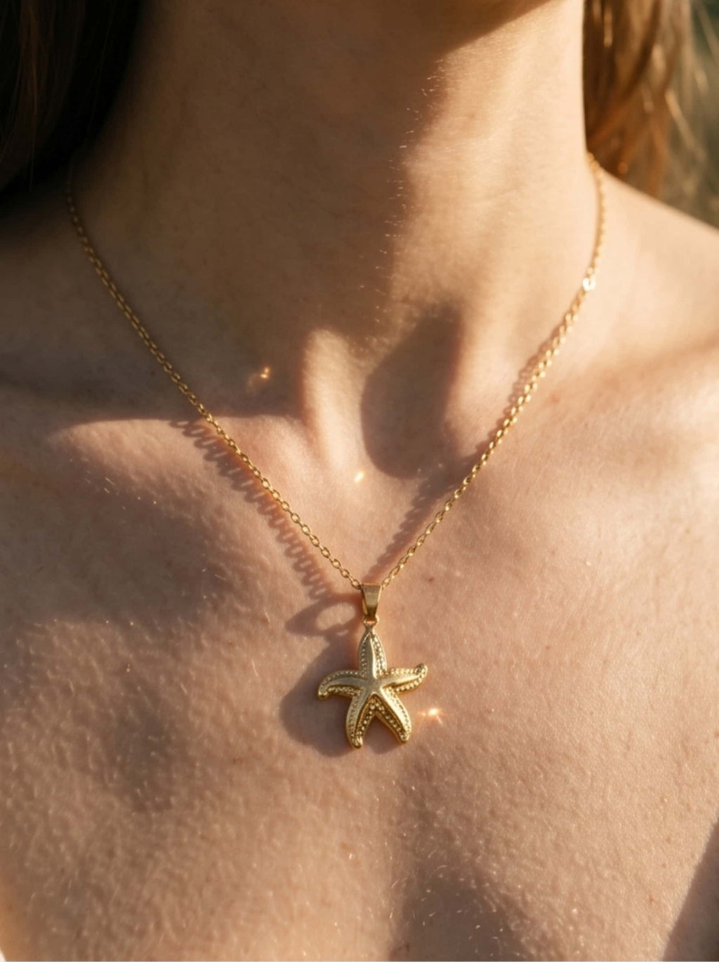 Macro view highlighting the fine textures, premium craftsmanship, and polished finish of the pendant on the gold starfish necklace