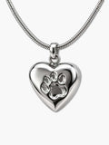 Polished heart-shaped dog ashes necklace with a paw print design and matching chain on a white background
