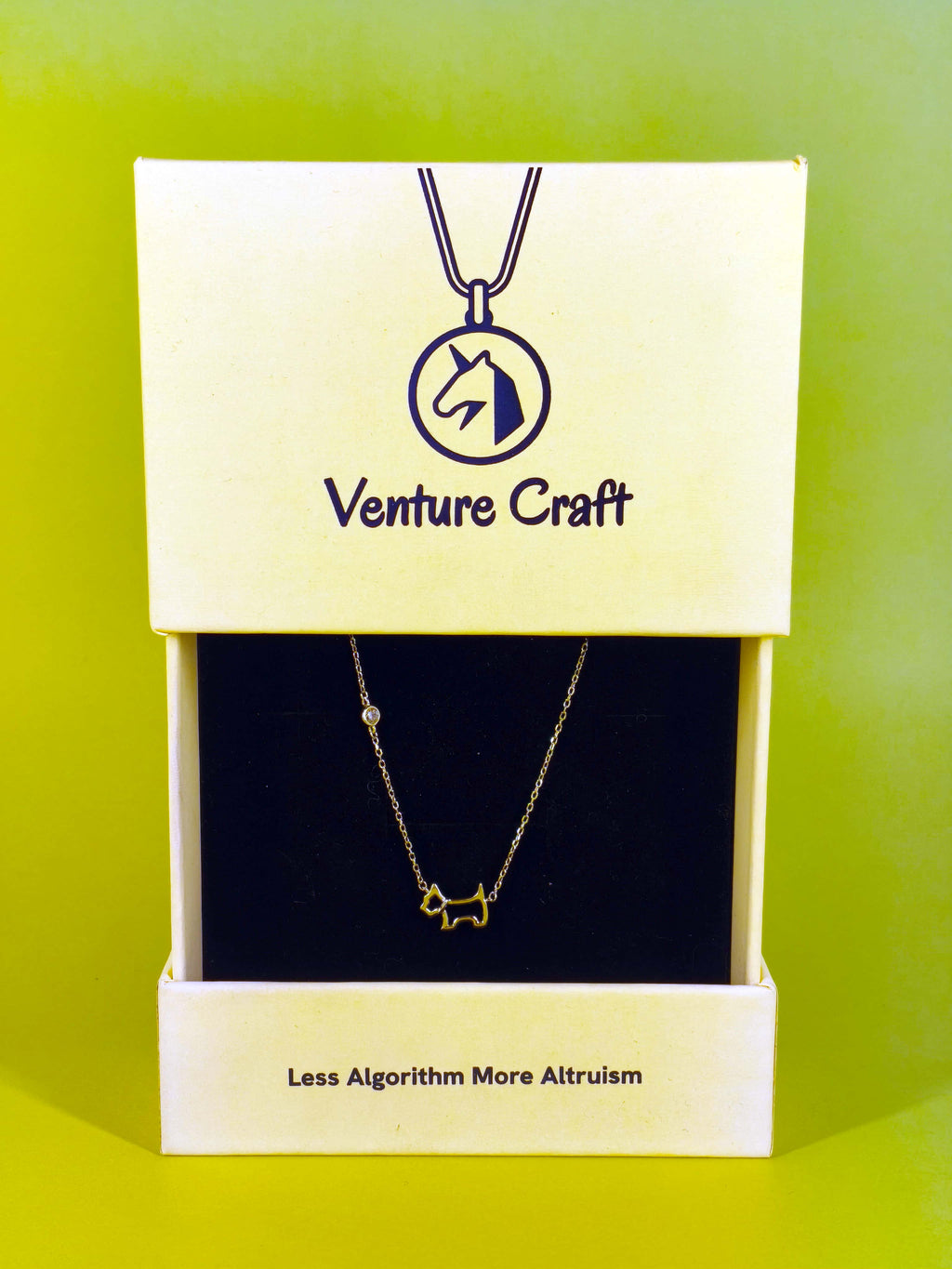 The sterling silver dog necklace beautifully presented inside a yellow Venture Craft branded gift box, ready for gifting.
