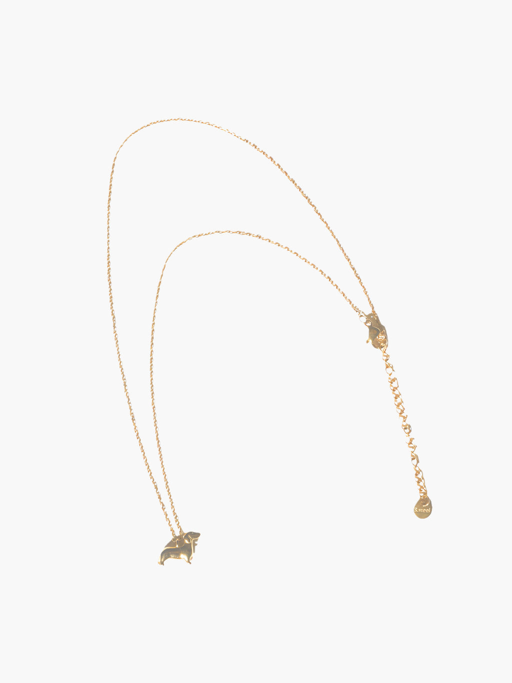Gold necklace with a small dog-shaped pendant on a white background