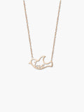 Gold dove pendant necklace on a white background