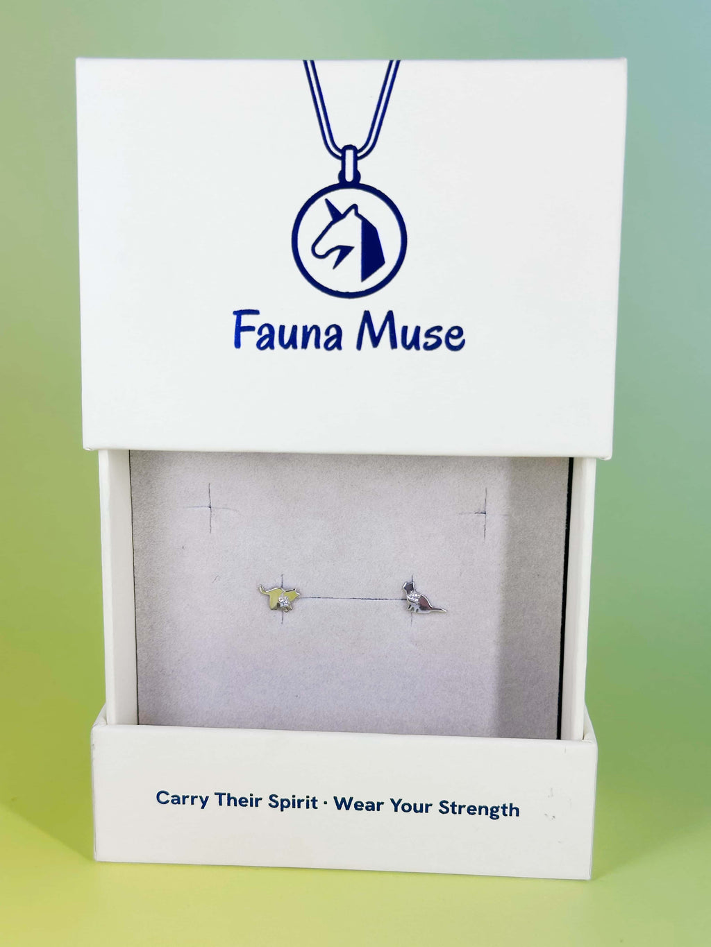 Fauna Muse asymmetrical cat stud earrings with crystal accents displayed in a white branded jewelry gift box