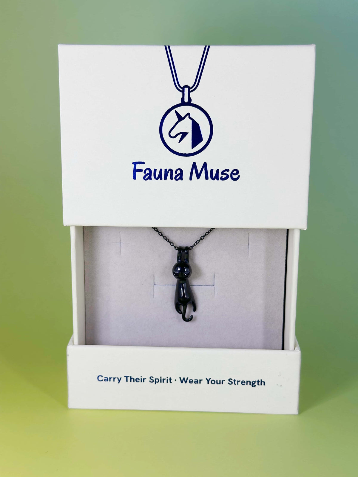 Fauna Muse black cat pendant necklace displayed inside a white branded gift box