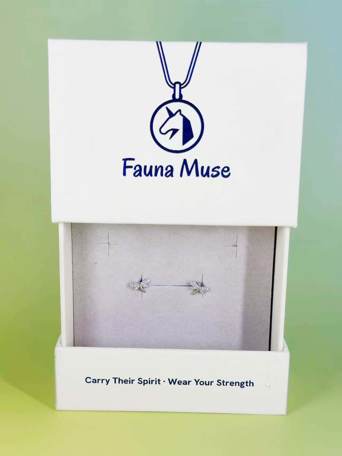 Fauna Muse crystal dragonfly stud earrings with pavé wings displayed in a white branded jewelry gift box
