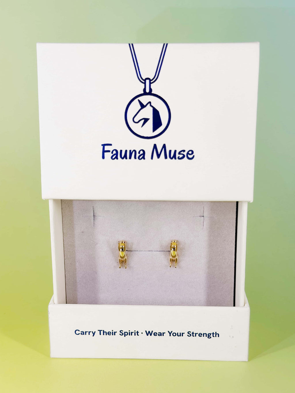 Fauna Muse gold climbing cat stud earrings displayed in a white branded jewelry gift box