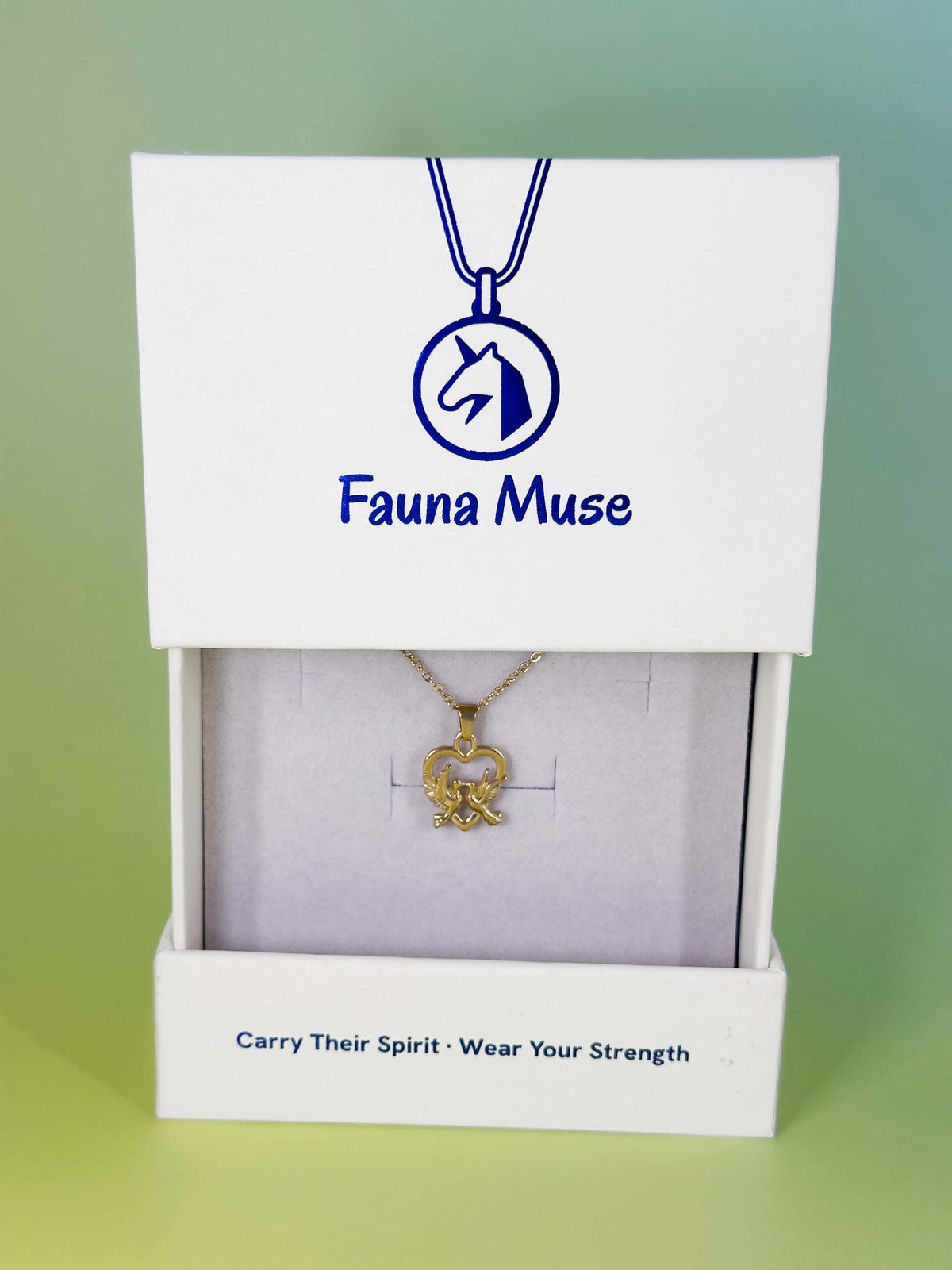 Fauna Muse gold double dove heart pendant necklace displayed inside a white branded gift box