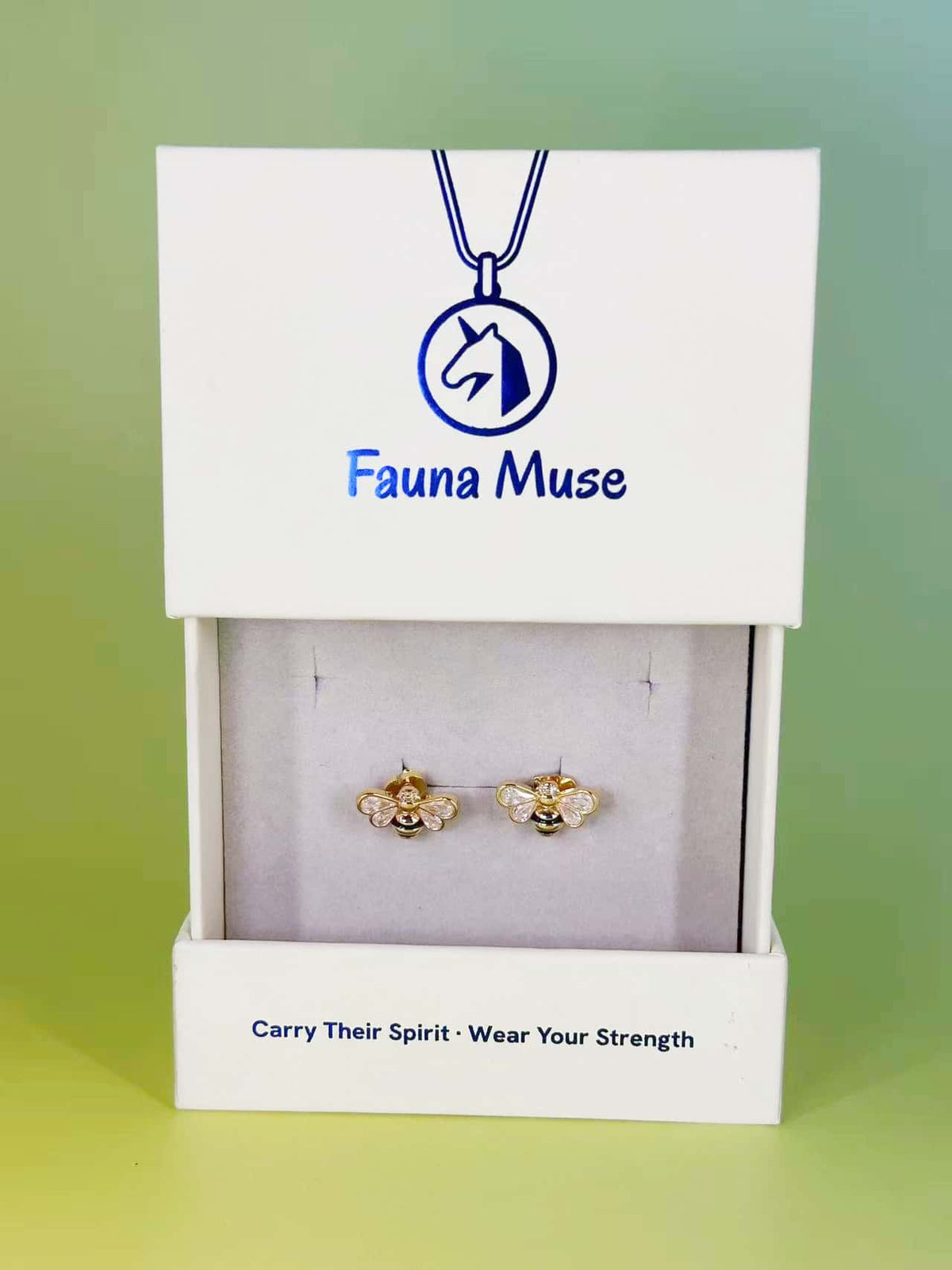 Fauna Muse gold honey bee stud earrings with crystal wings displayed in a white branded jewelry gift box