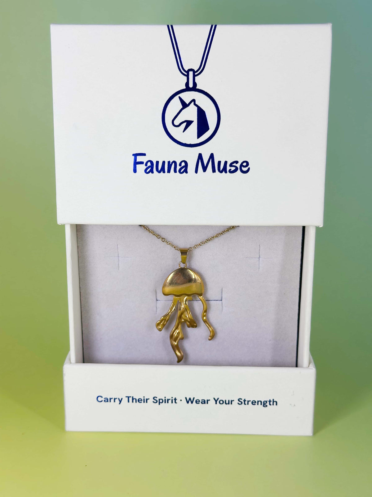Fauna Muse gold jellyfish pendant necklace displayed inside a white branded gift box