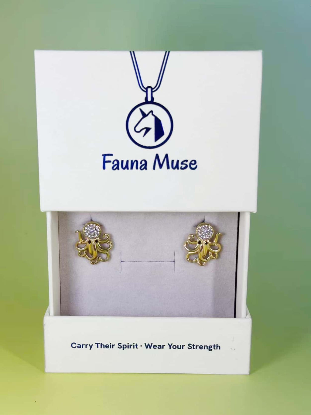 Fauna Muse gold octopus stud earrings with pavé crystal accents displayed in a white branded jewelry gift box