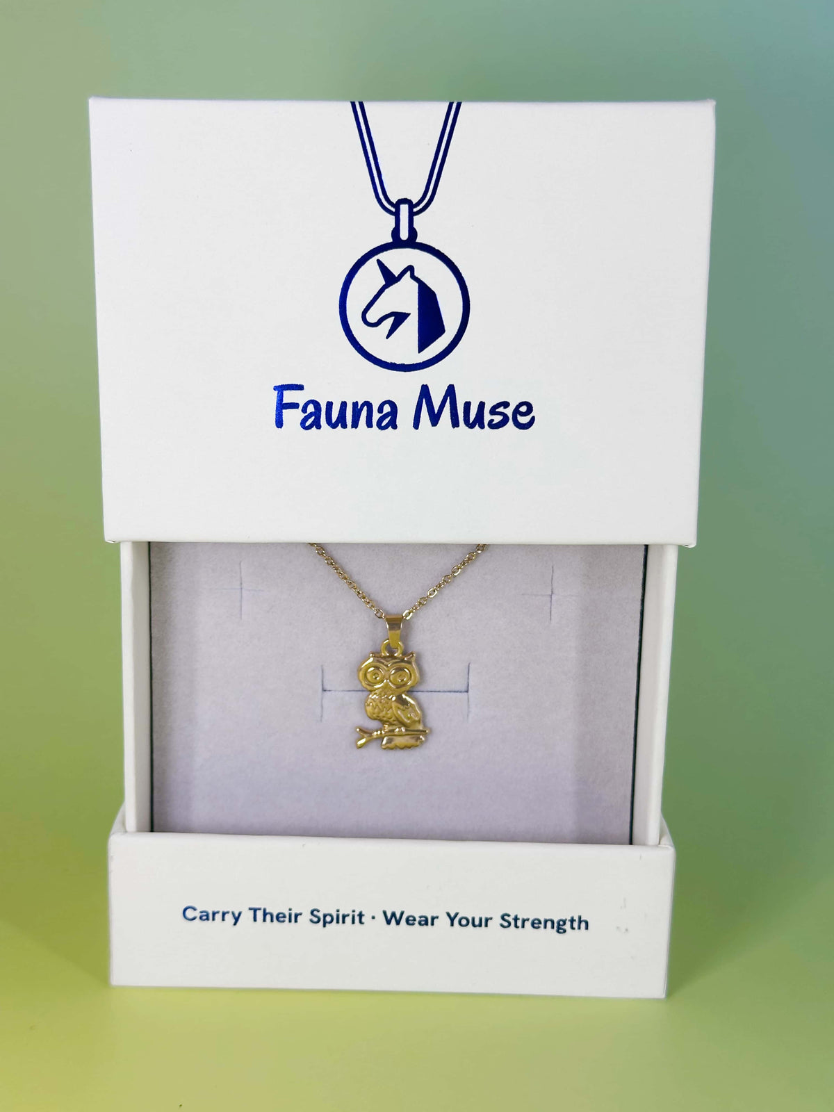 Fauna Muse gold owl pendant necklace displayed inside a white branded gift box