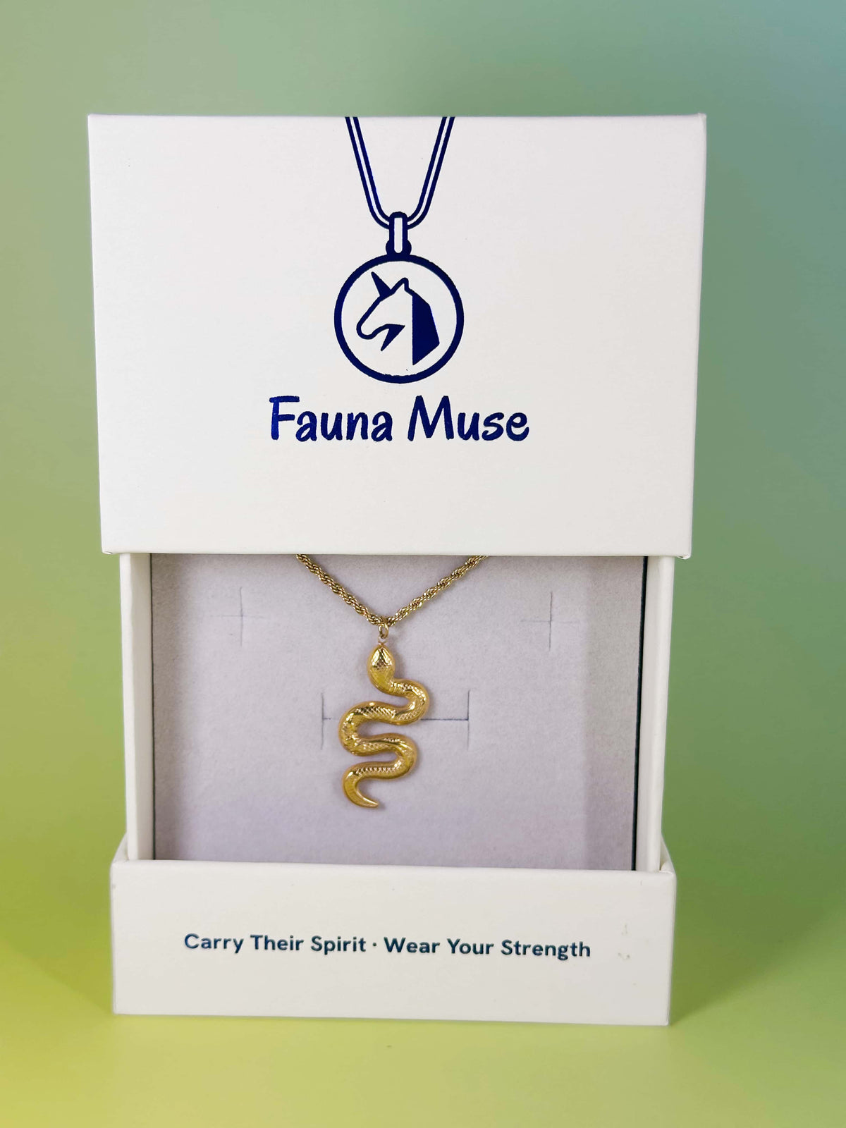 Fauna Muse gold snake pendant necklace displayed inside a white branded gift box