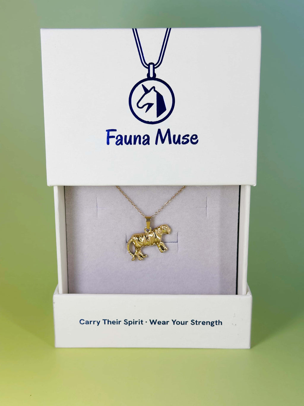 Fauna Muse gold tiger pendant necklace displayed inside a white branded gift box