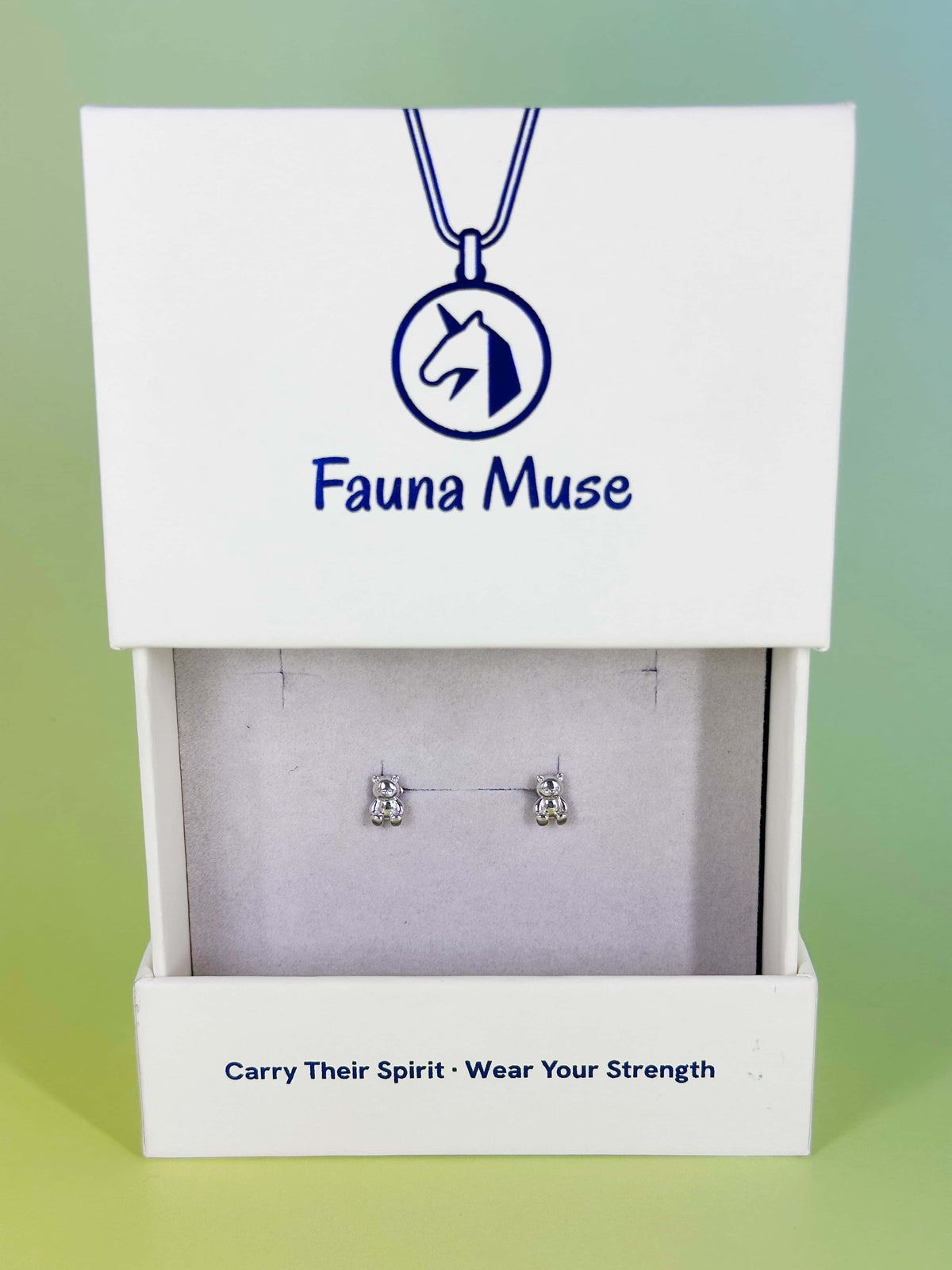 Fauna Muse silver bear stud earrings displayed in a white branded jewelry gift box