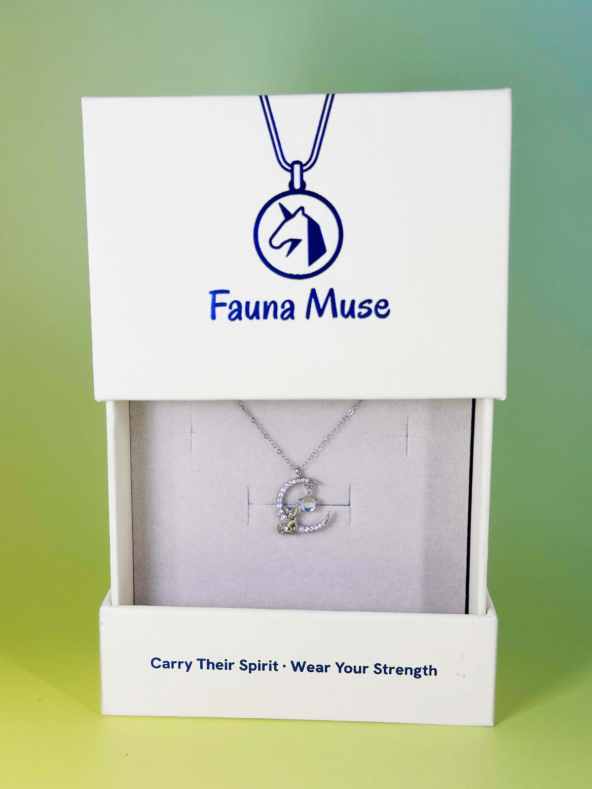 Fauna Muse silver cat on crystal crescent moon pendant necklace displayed inside a white branded gift box