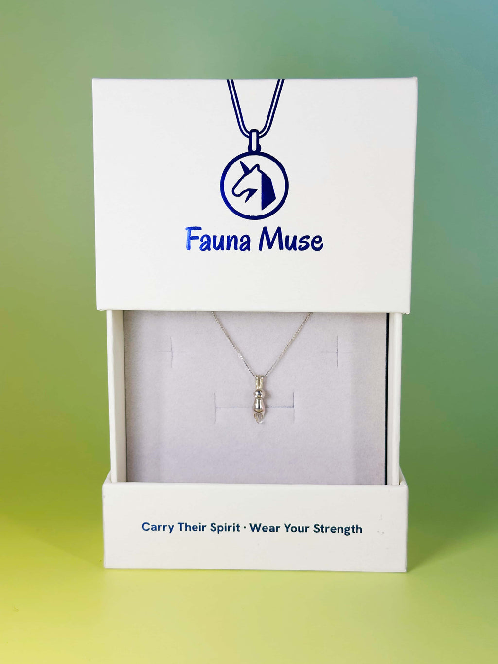 Fauna Muse silver cat pendant necklace displayed inside a white branded gift box
