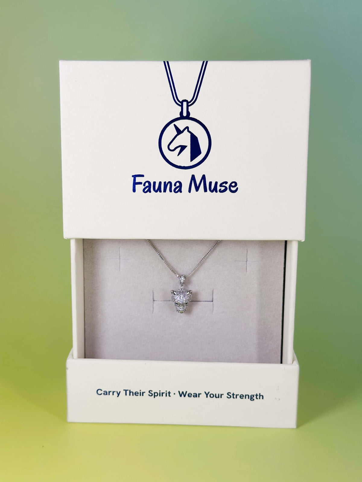 Fauna Muse silver pave crystal leopard head pendant necklace displayed inside a white branded gift box