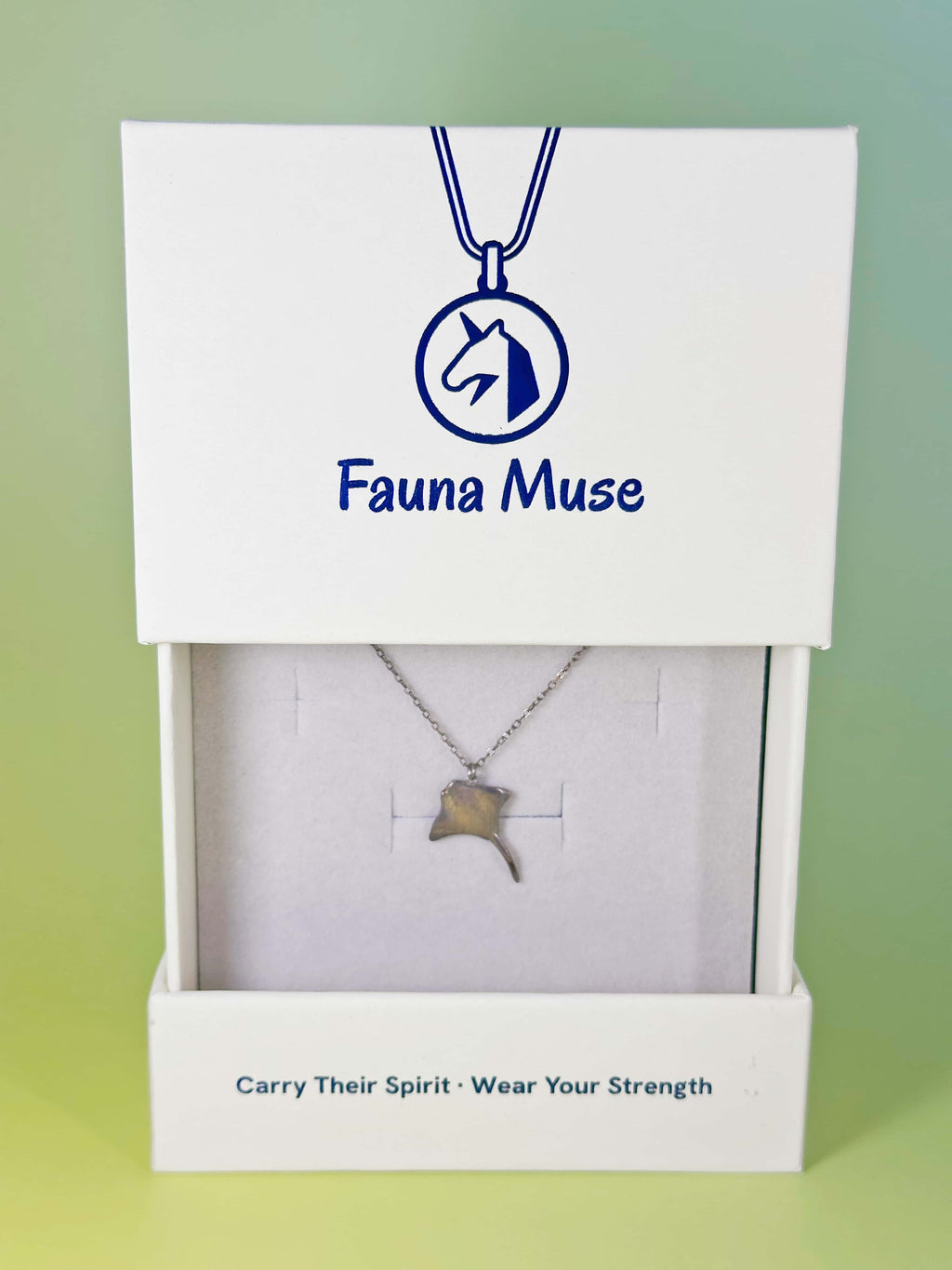 Fauna Muse silver stingray pendant necklace displayed inside a white branded gift box