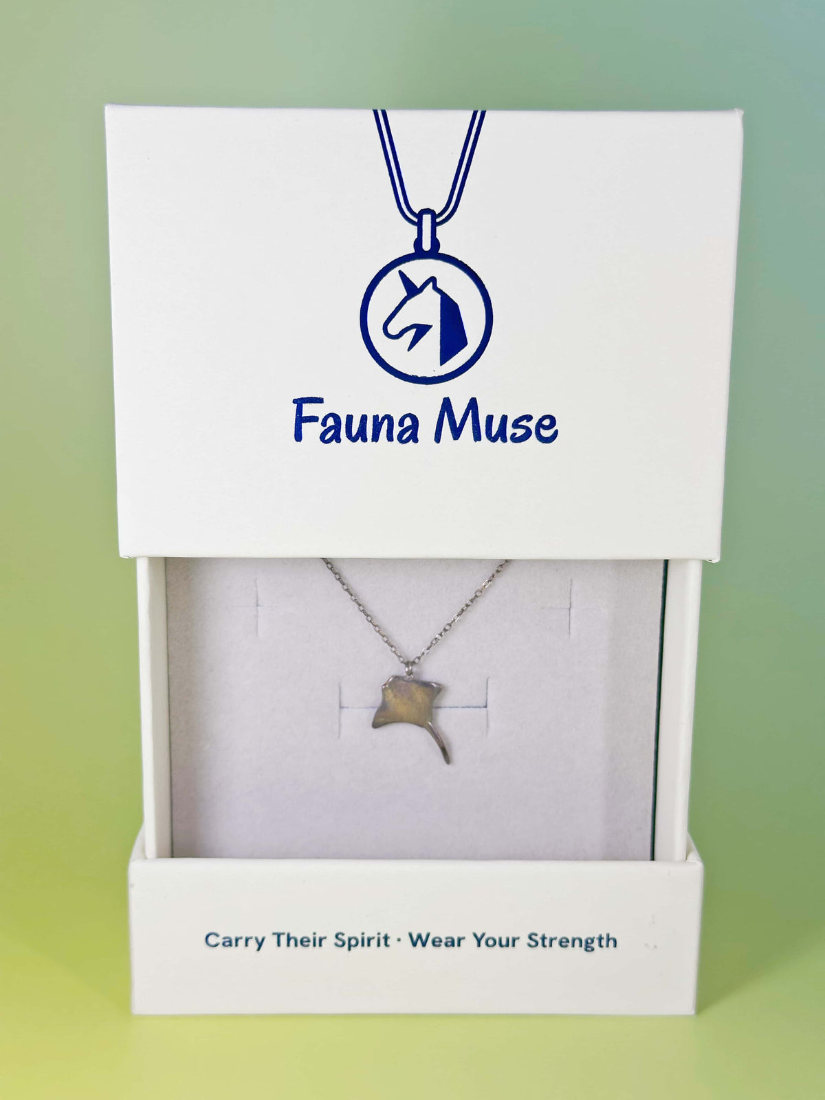 Fauna Muse silver stingray pendant necklace displayed inside a white branded gift box