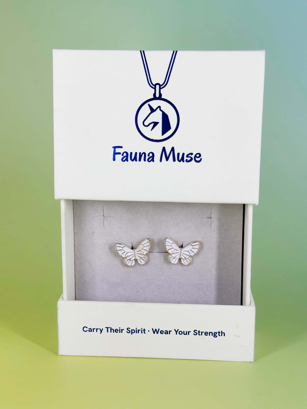 Fauna Muse delicate sparkling dragonfly jewelry in signature white gift packaging with Carry Their Spirit slogan