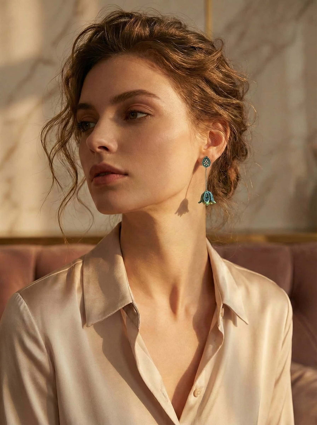 Woman wearing a beige shirt with a blurred background