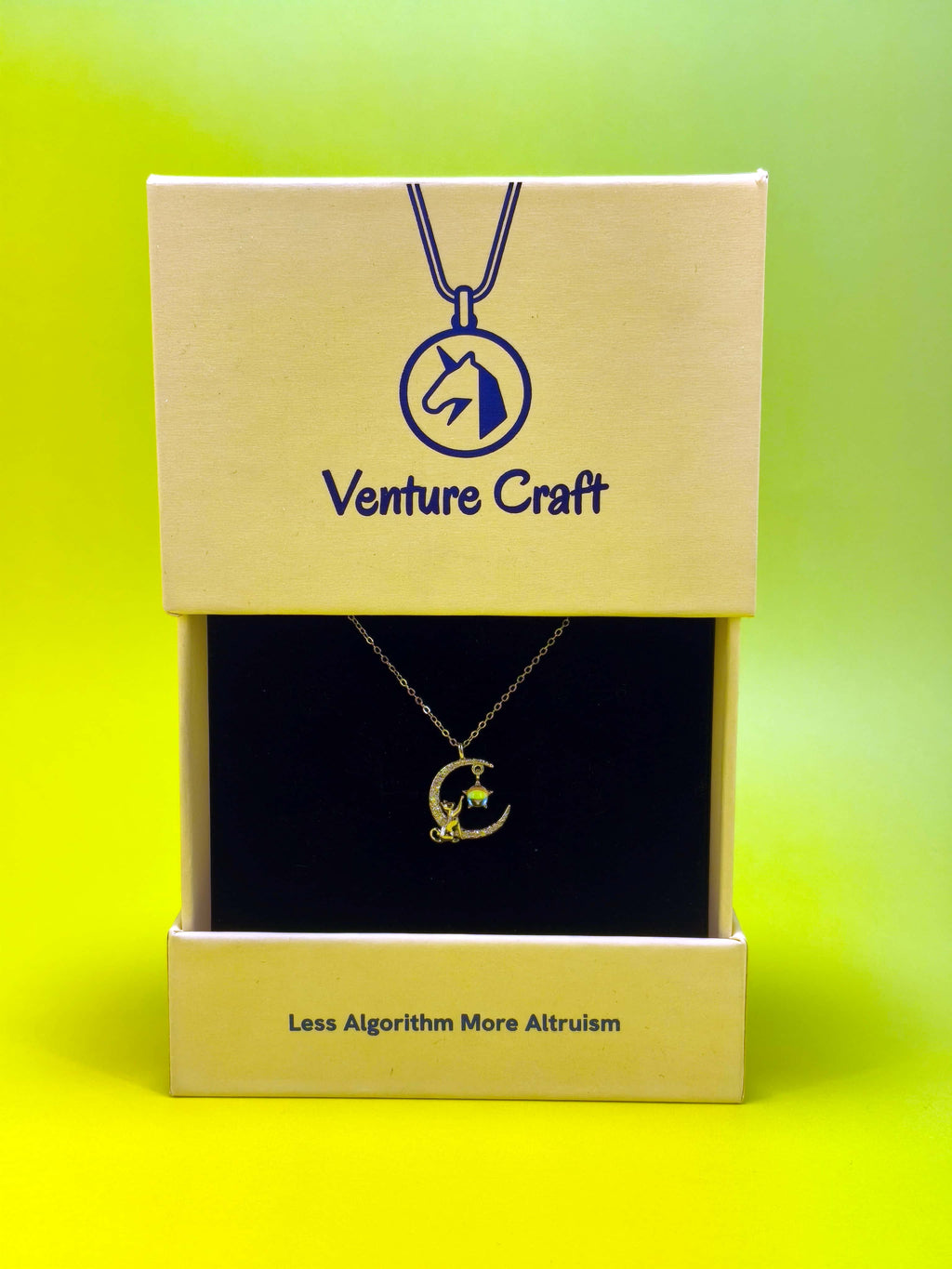 A beautifully packaged sterling silver cat necklace displayed inside a Venture Craft gift box featuring the "Less Algorithm More Altruism" slogan, perfect for gifting.
