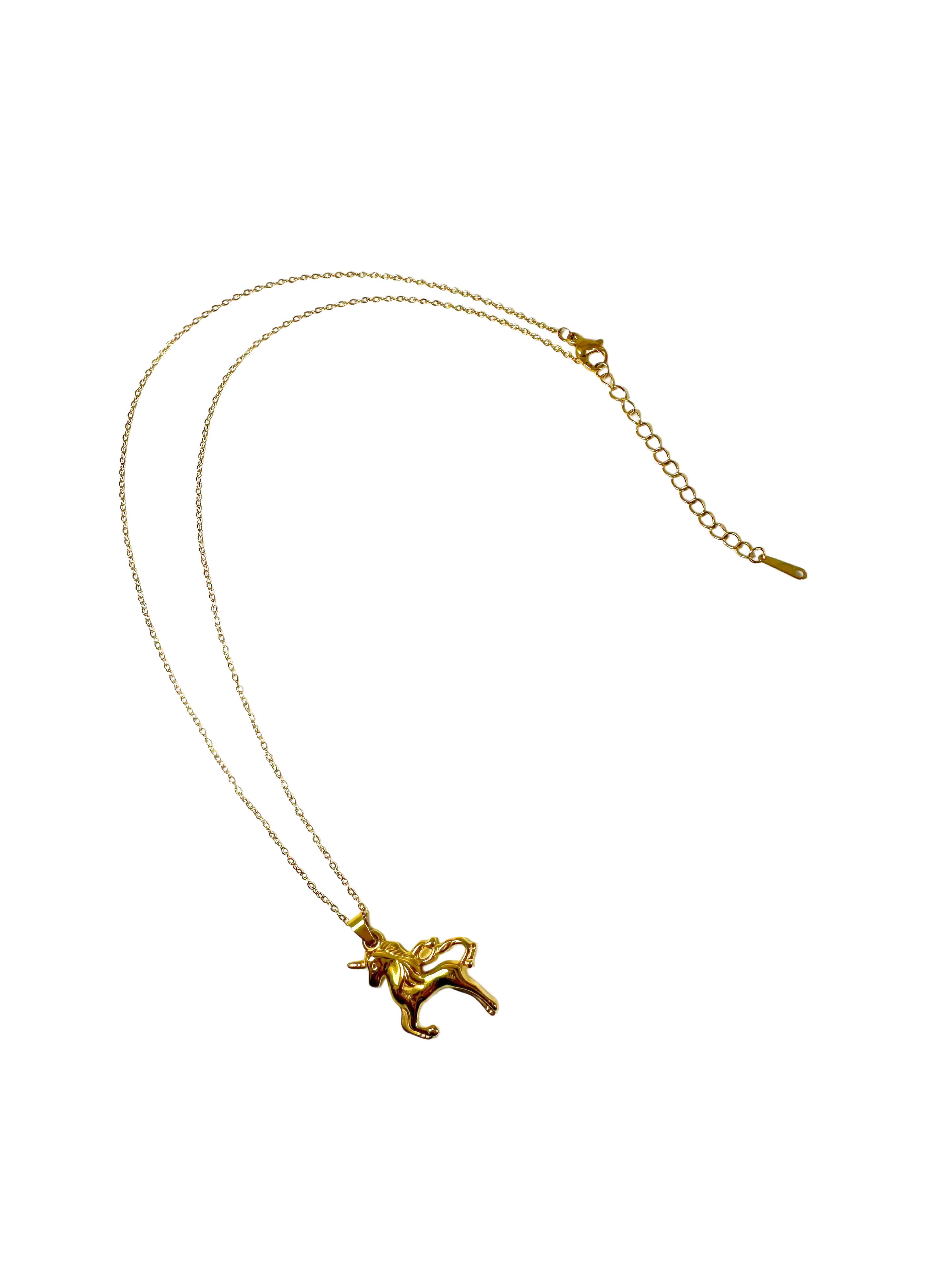 Full length view of the 18K gold unicorn necklace on a delicate chain