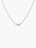 gold dolphin pendant necklace on a white background