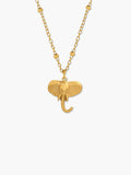 gold elephant pendant necklace on a white background