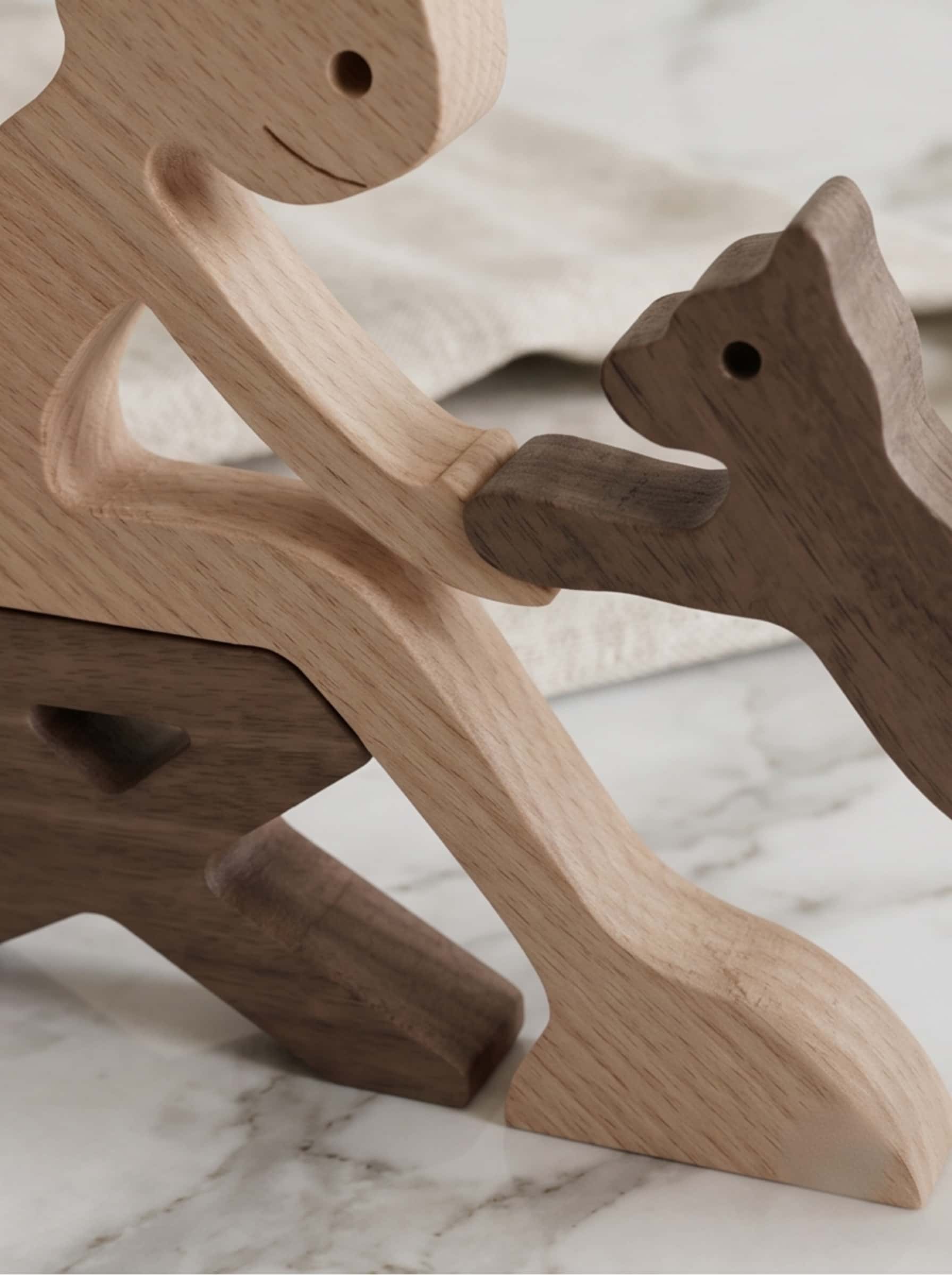Close-up detail of the smooth interlocking pieces of a sculpture from wood, highlighting the natural grain of beech and walnut.