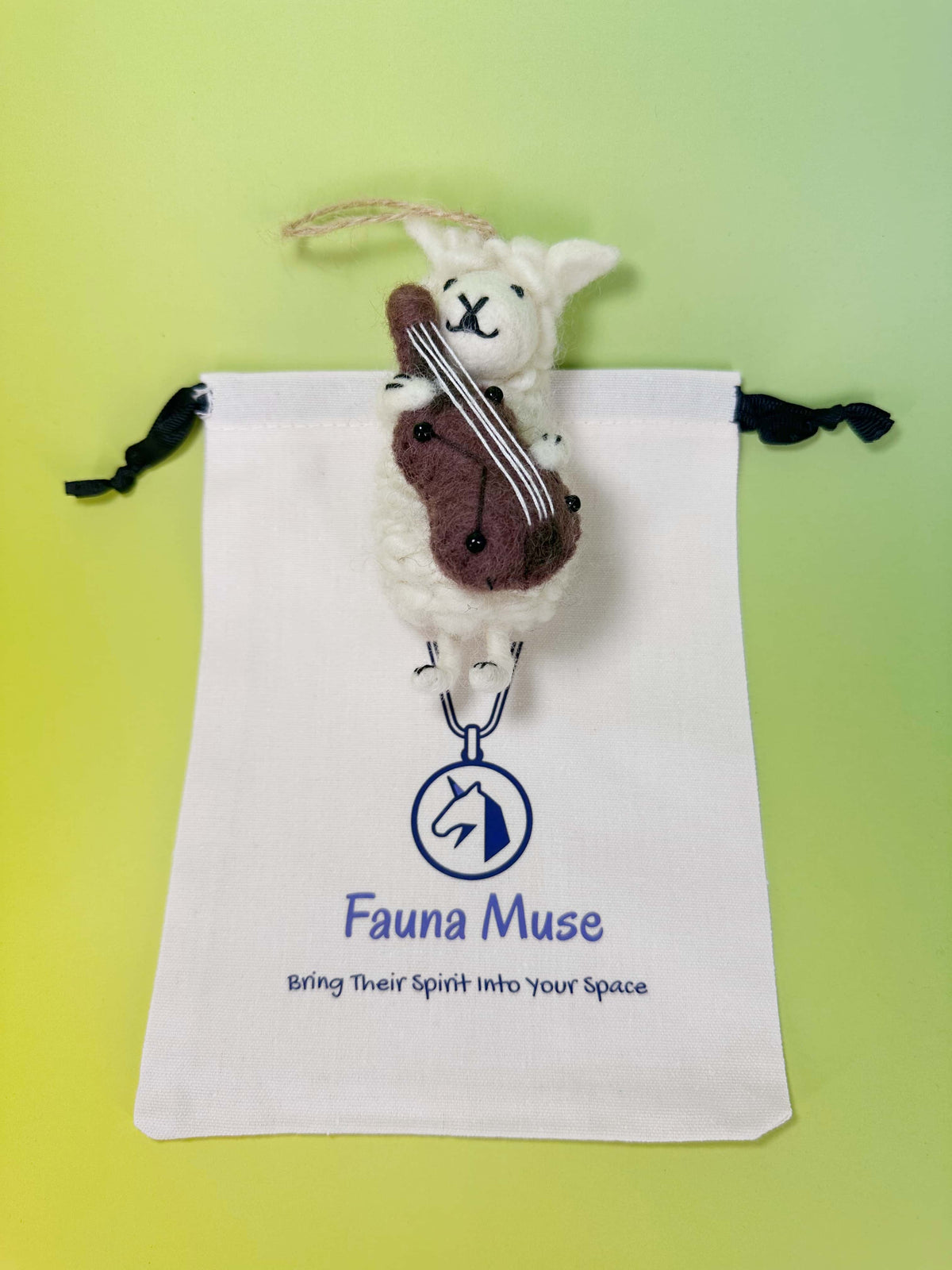 Handmade needle felted wool sheep ornament playing a miniature violin with Fauna Muse gift pouch