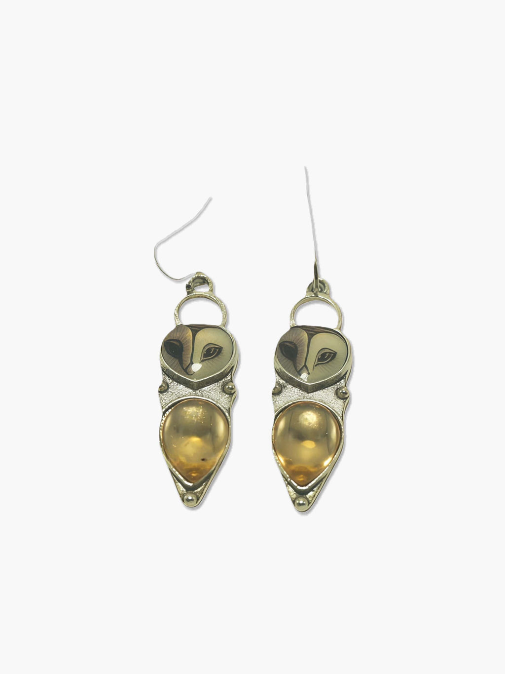 Pair of owl earrings on a white background