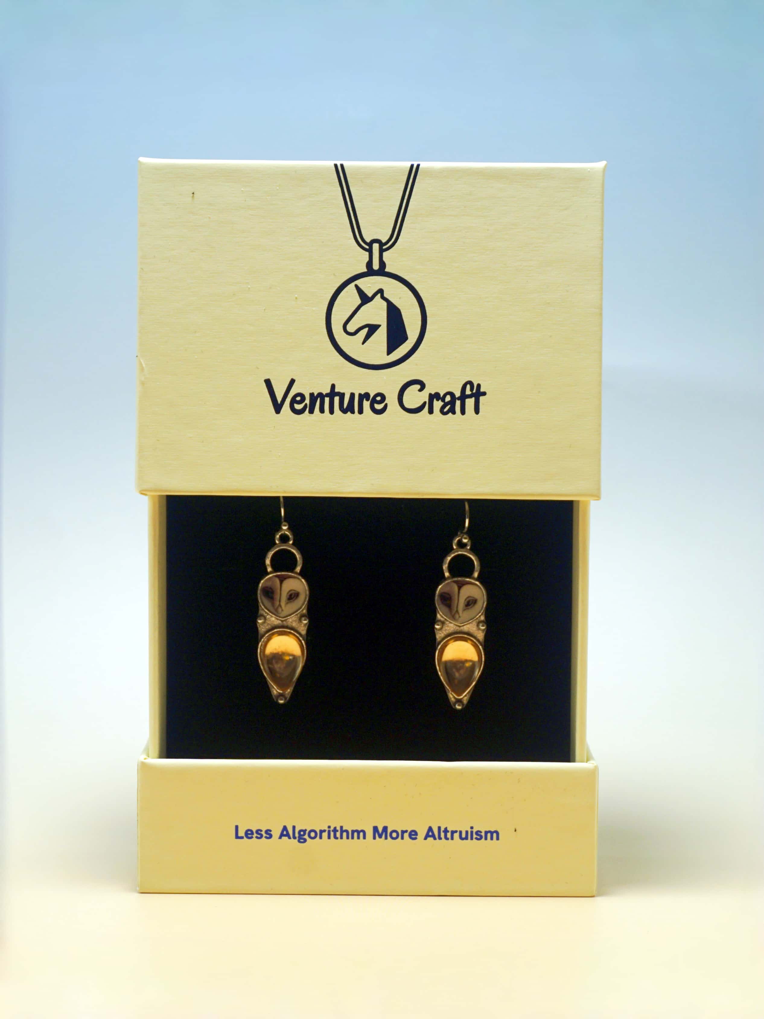 owl earrings  in a Venture Craft gift box with a blue gradient background