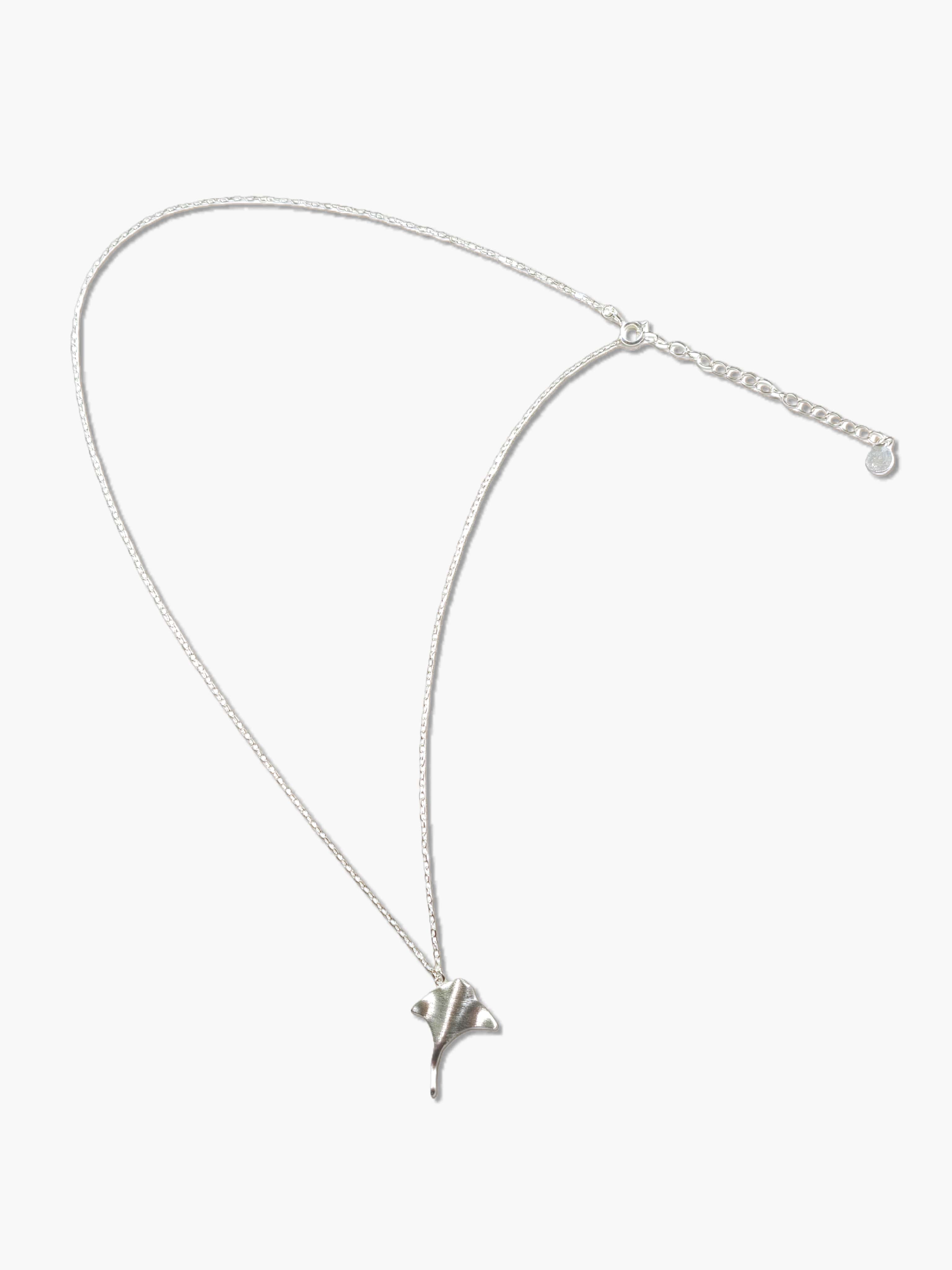 sterling silver manta ray necklace on a white background