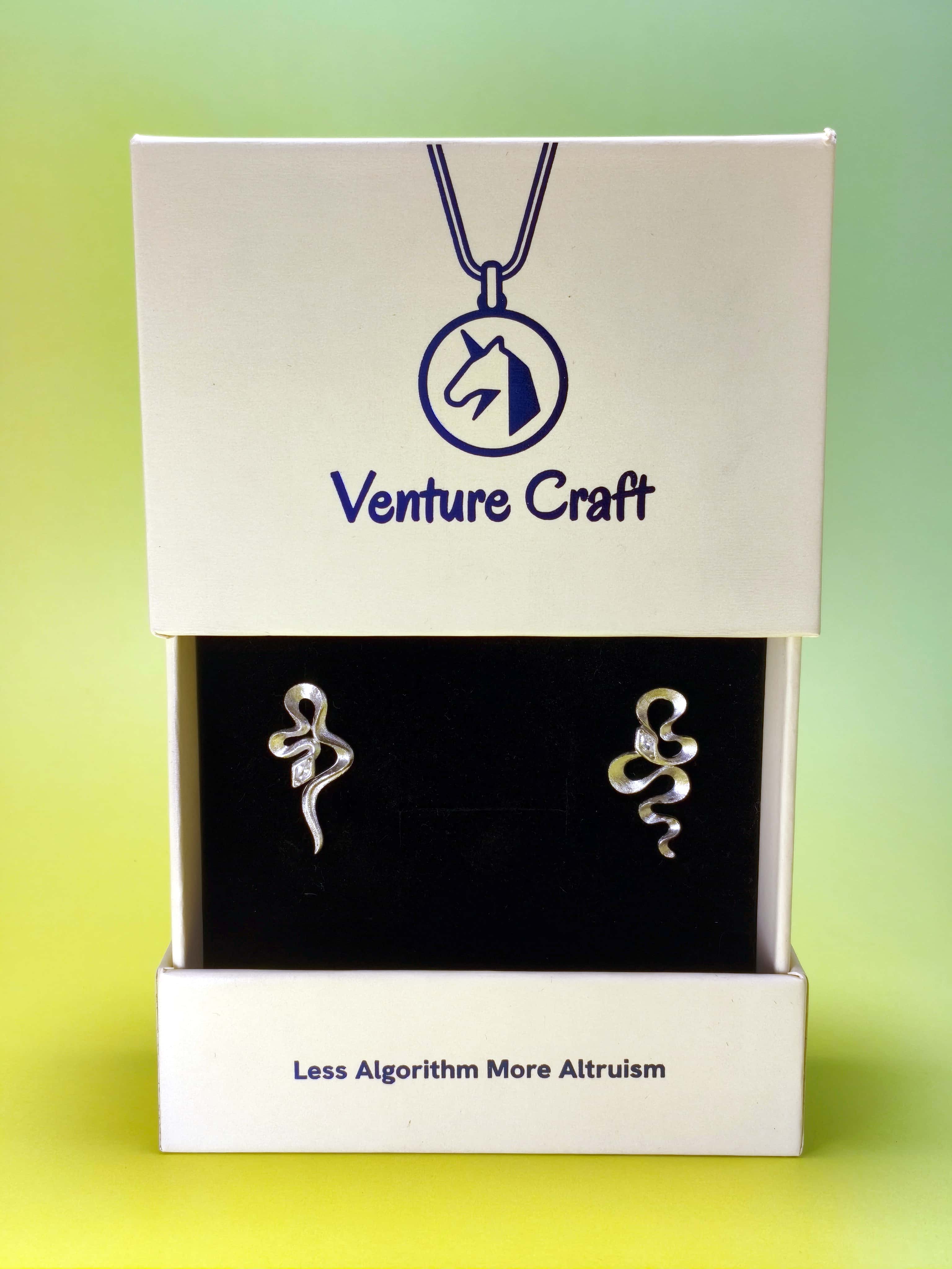 silver snake  earrings in a Venture Craft gift box with a gradient background