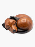 Curled sleeping dog urn crafted from high-quality resin with a warm wood-grain finish and black ears