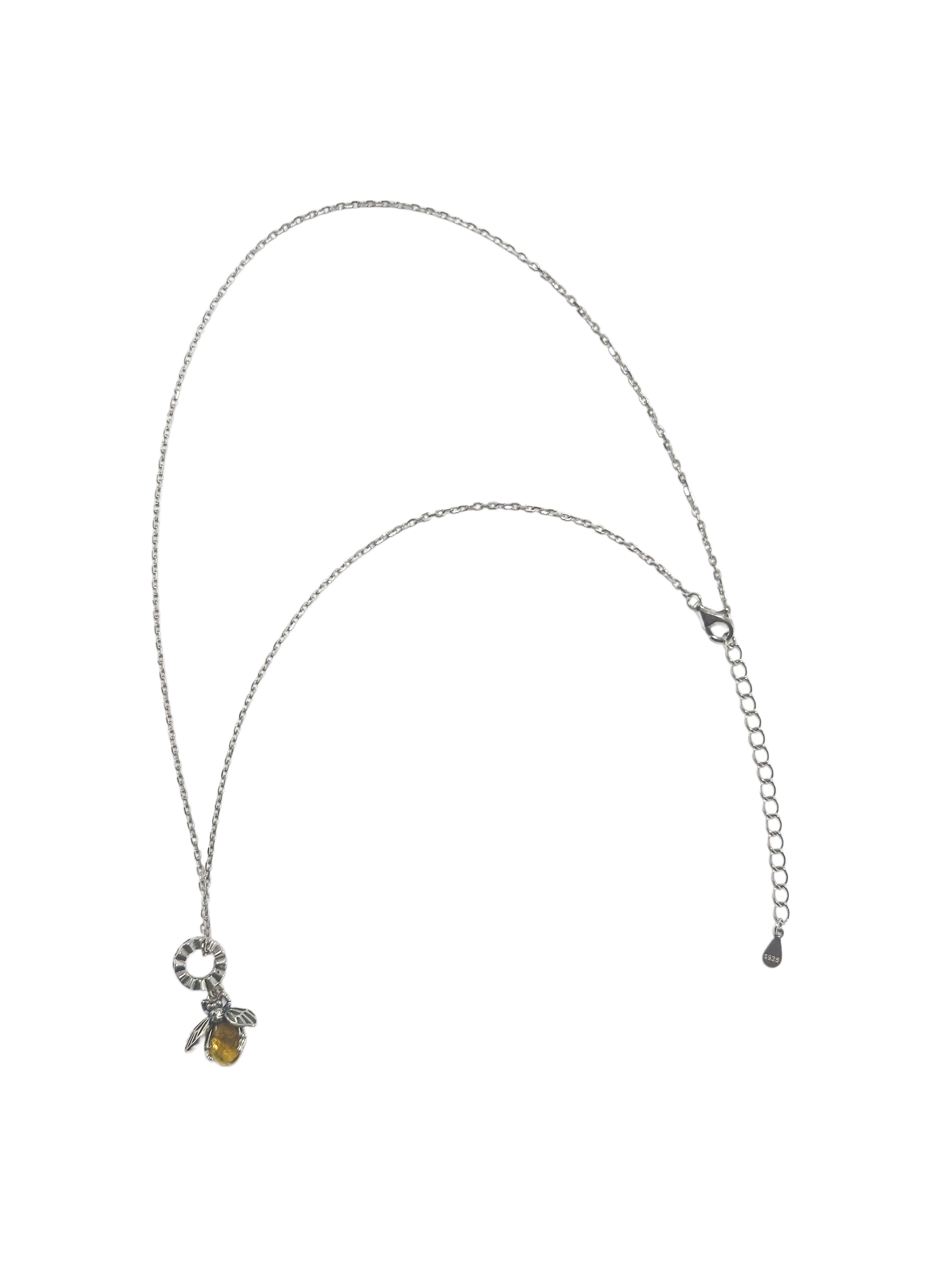 A delicate sterling silver bee necklace featuring a detailed bee pendant with a golden-yellow crystal body, isolated on a clean white background