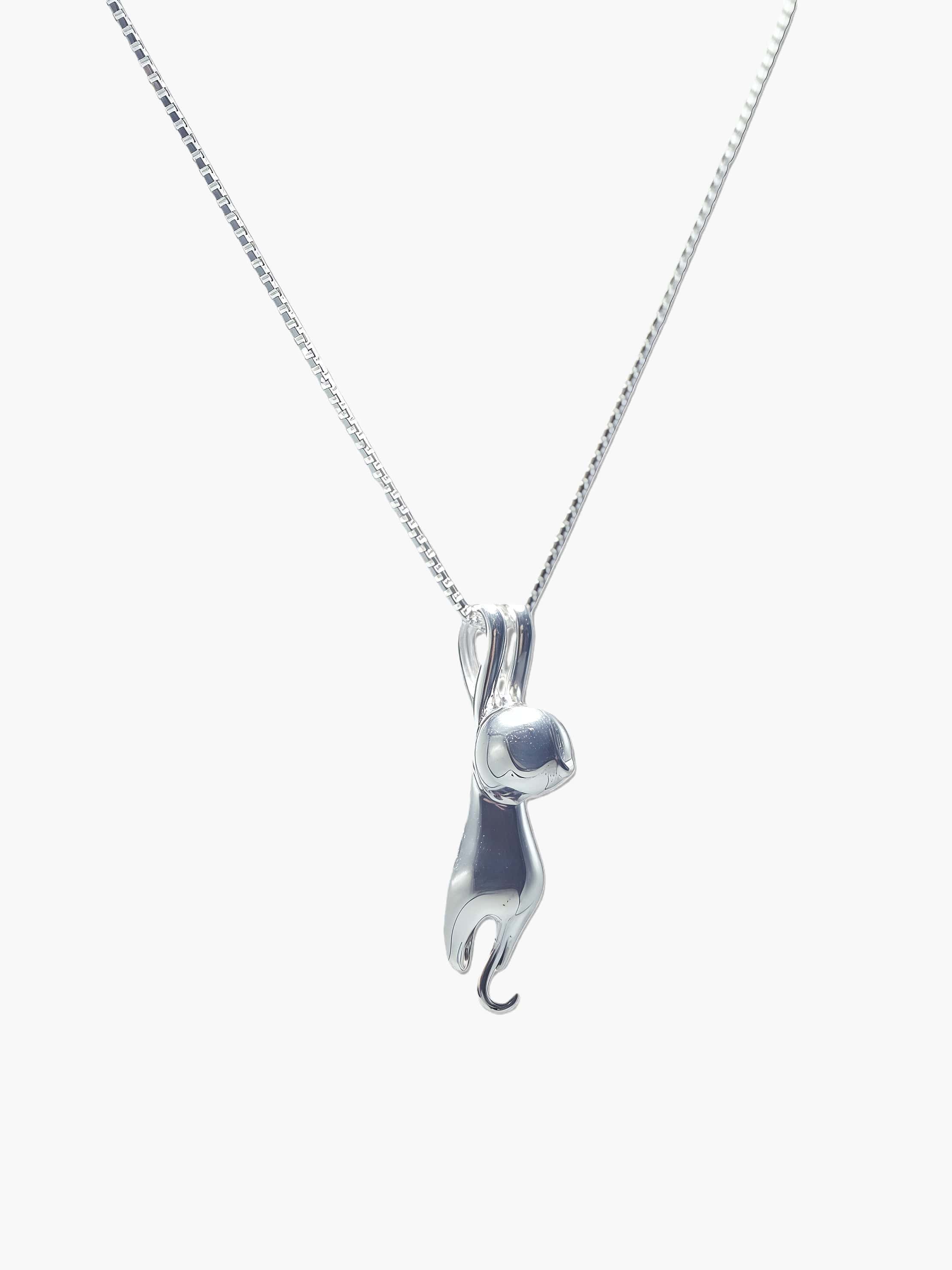 sterling silver cat pendant necklace on a chain against a white background