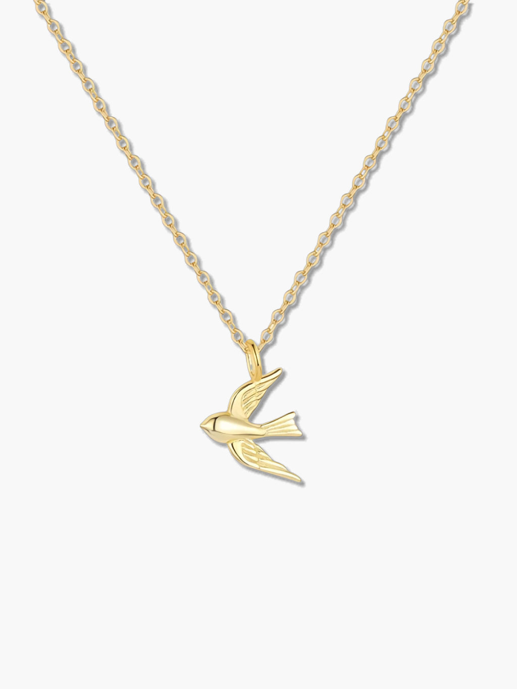 18K gold swallow bird necklace on a white background