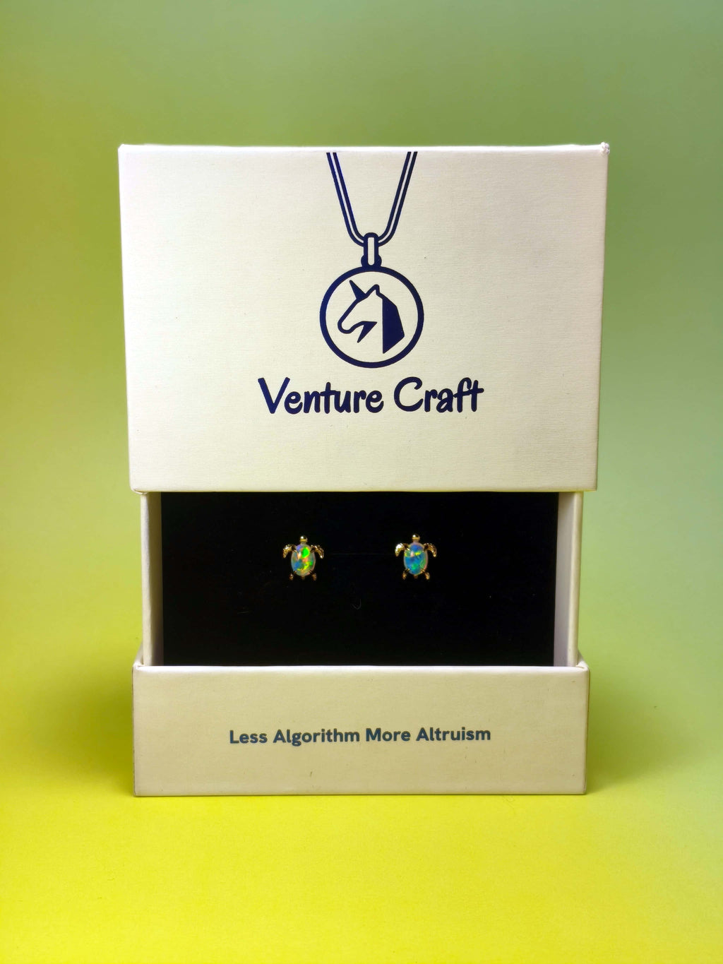 sea turtle earrings set in a Venture Craft gift box on a gradient background