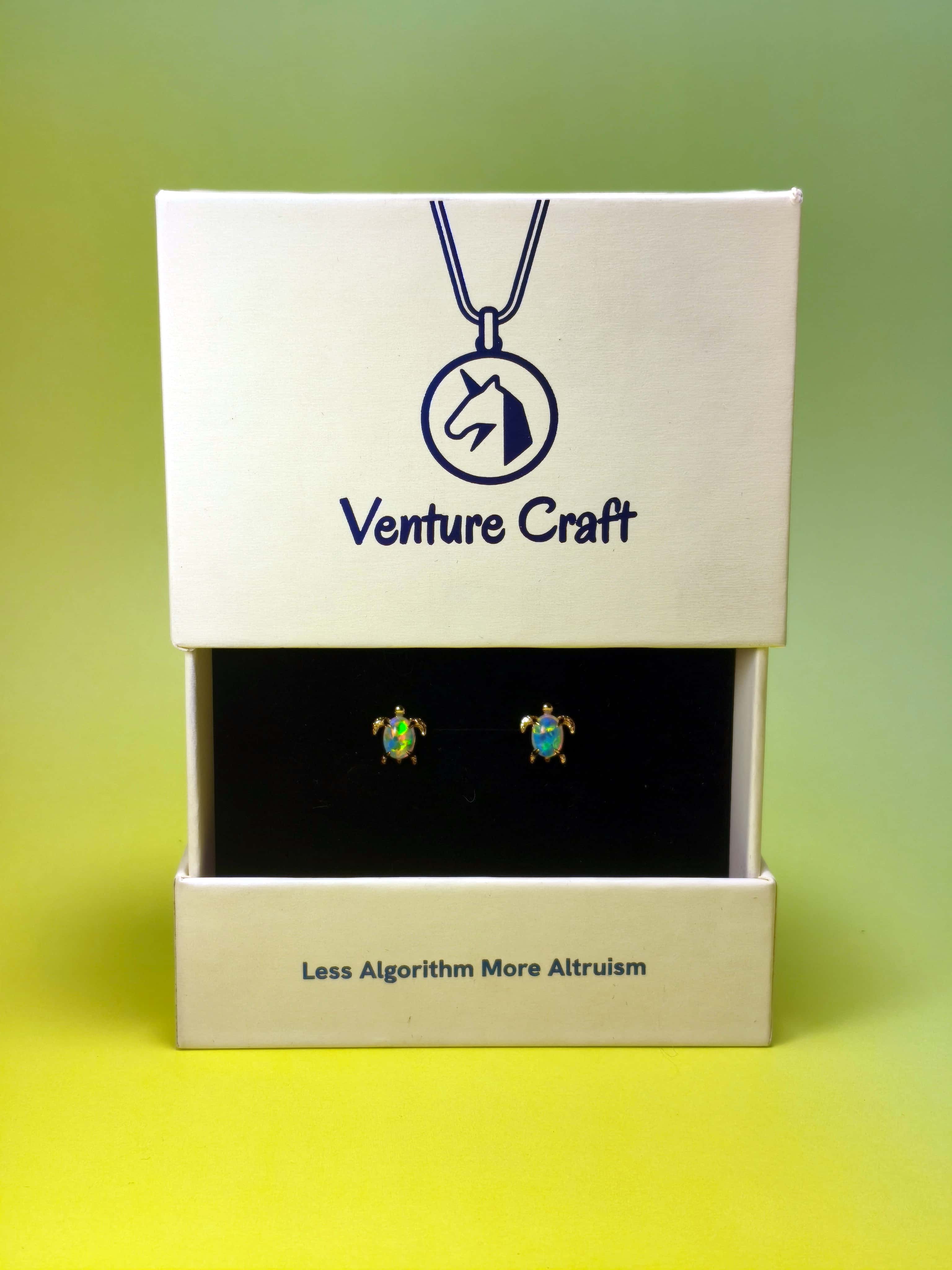 sea turtle earrings set in a Venture Craft gift box on a gradient background