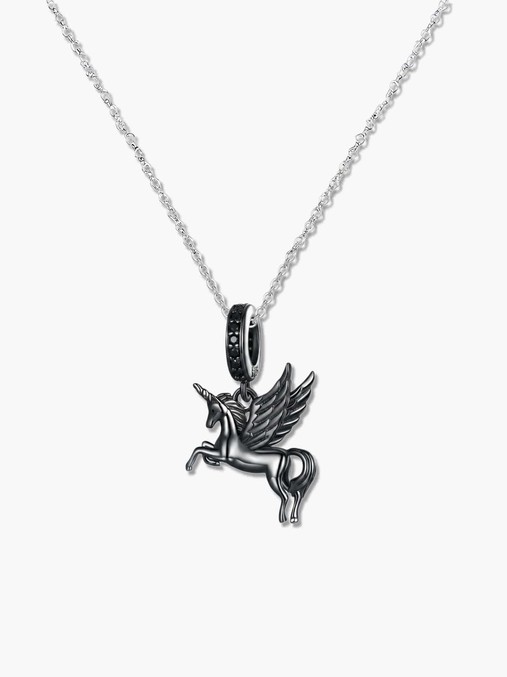 Macro studio shot of the winged unicorn necklace pendant on a white background, revealing the S925 hallmark, the sleek black rhodium plating, and the elegant black stones embedded in the bail